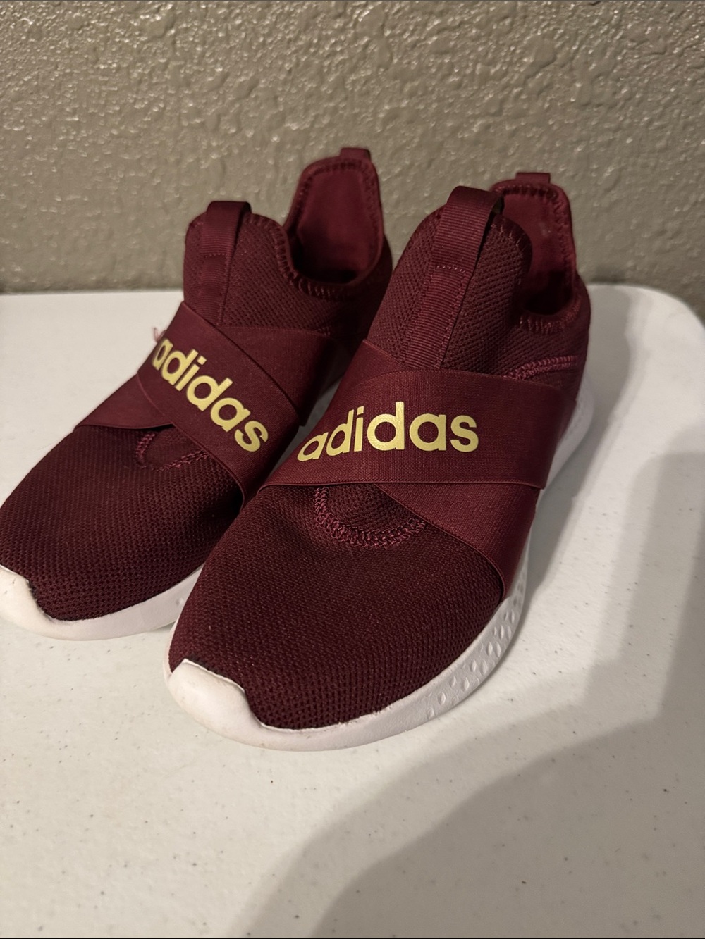 adidas men’s  Burgundy Slip-On Sneakers with Gold Logo